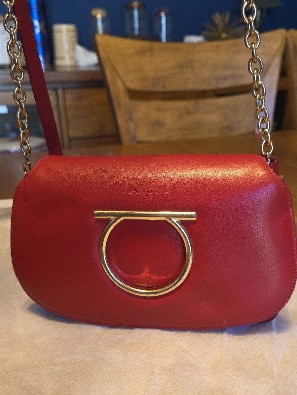 Salvatore Ferragamo Gancini mini bag featuring gold-tone hardware.